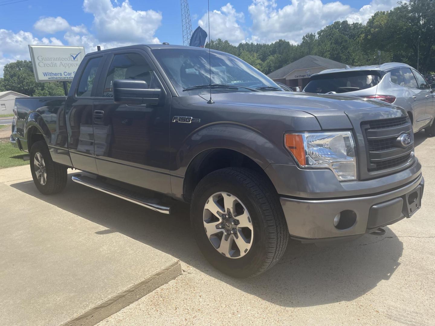 2013 Gray /Gray Ford F-150 Lariat SuperCab 6.5-ft. Bed 4WD (1FTFX1EF1DK) with an 5.0L V8 engine, 6-Speed Automatic transmission, located at 204 Hwy. 16 East, Carthage, MS, 39051, (601) 267-7277, 0.000000, 0.000000 - Photo#1