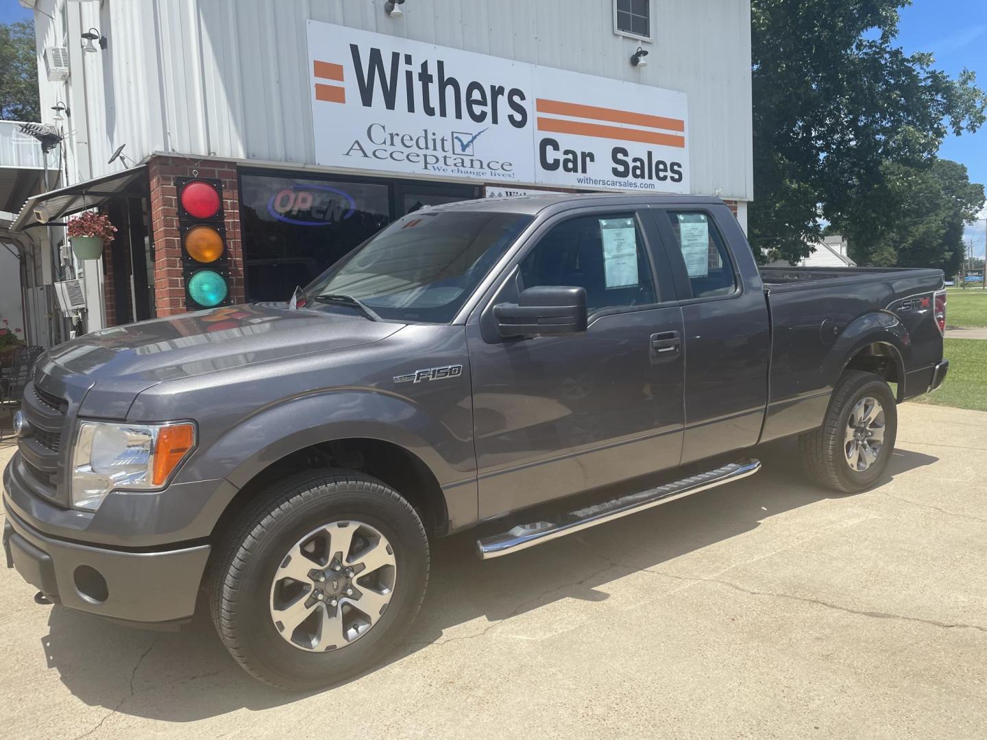 2013 Gray /Gray Ford F-150 Lariat SuperCab 6.5-ft. Bed 4WD (1FTFX1EF1DK) with an 5.0L V8 engine, 6-Speed Automatic transmission, located at 204 Hwy. 16 East, Carthage, MS, 39051, (601) 267-7277, 0.000000, 0.000000 - Photo#0