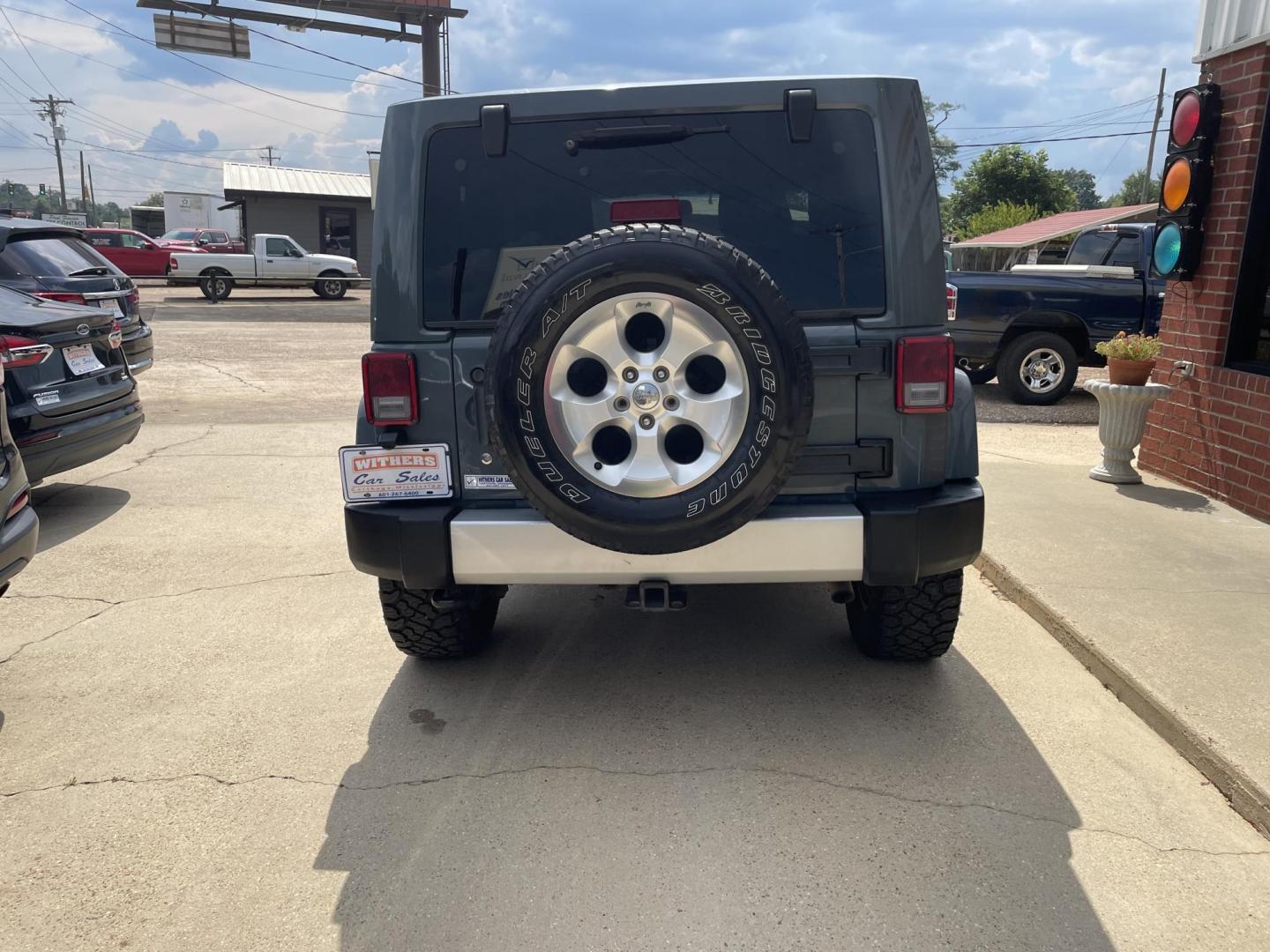 2014 Gray /Black Jeep Wrangler Sahara 4WD (1C4AJWBG7EL) with an 3.6L V6 DOHC 24V FFV engine, Auto transmission, located at 204 Hwy. 16 East, Carthage, MS, 39051, (601) 267-7277, 0.000000, 0.000000 - Photo#3