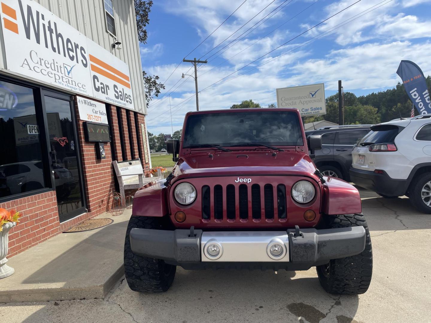 2013 Maroon /Black Jeep Wrangler Unlimited Sahara 4WD (1C4BJWEG8DL) with an 3.6L V6 DOHC 24V FFV engine, located at 204 Hwy. 16 East, Carthage, MS, 39051, (601) 267-7277, 0.000000, 0.000000 - Photo#2