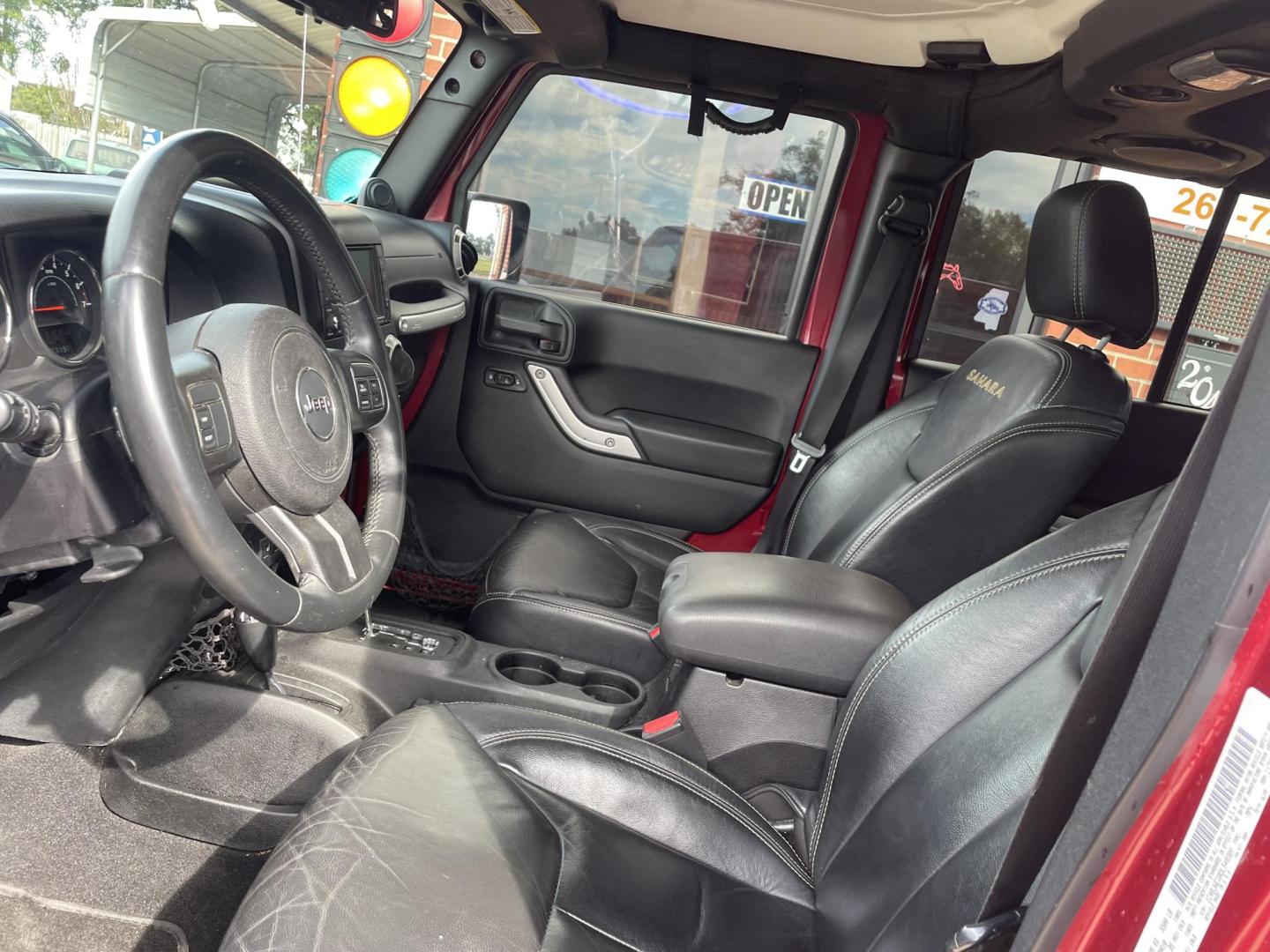 2013 Maroon /Black Jeep Wrangler Unlimited Sahara 4WD (1C4BJWEG8DL) with an 3.6L V6 DOHC 24V FFV engine, located at 204 Hwy. 16 East, Carthage, MS, 39051, (601) 267-7277, 0.000000, 0.000000 - Photo#4