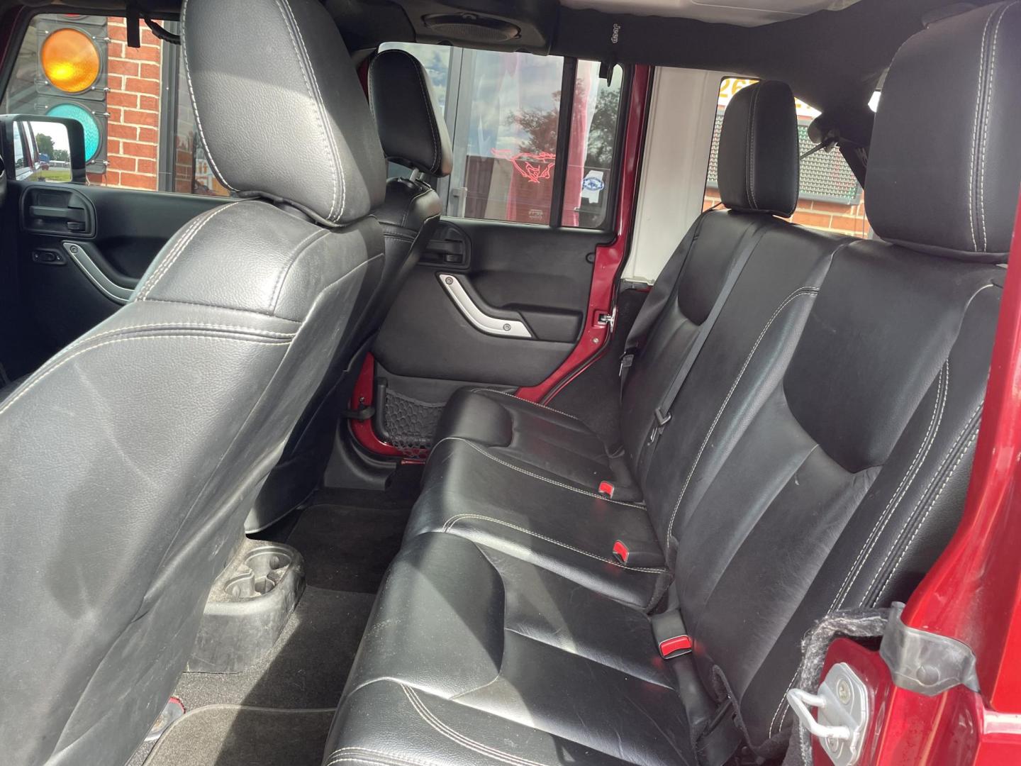 2013 Maroon /Black Jeep Wrangler Unlimited Sahara 4WD (1C4BJWEG8DL) with an 3.6L V6 DOHC 24V FFV engine, located at 204 Hwy. 16 East, Carthage, MS, 39051, (601) 267-7277, 0.000000, 0.000000 - Photo#6