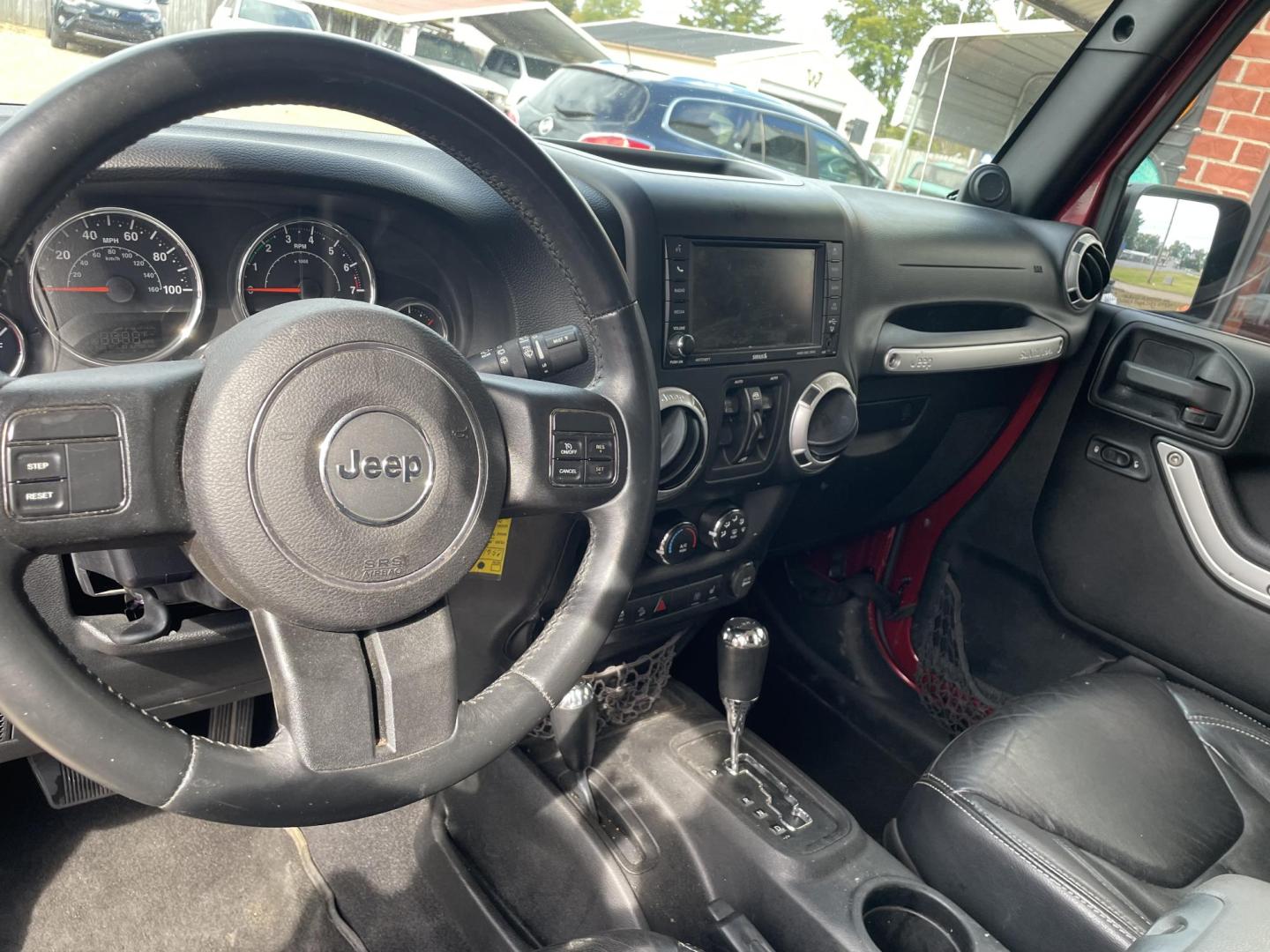 2013 Maroon /Black Jeep Wrangler Unlimited Sahara 4WD (1C4BJWEG8DL) with an 3.6L V6 DOHC 24V FFV engine, located at 204 Hwy. 16 East, Carthage, MS, 39051, (601) 267-7277, 0.000000, 0.000000 - Photo#5