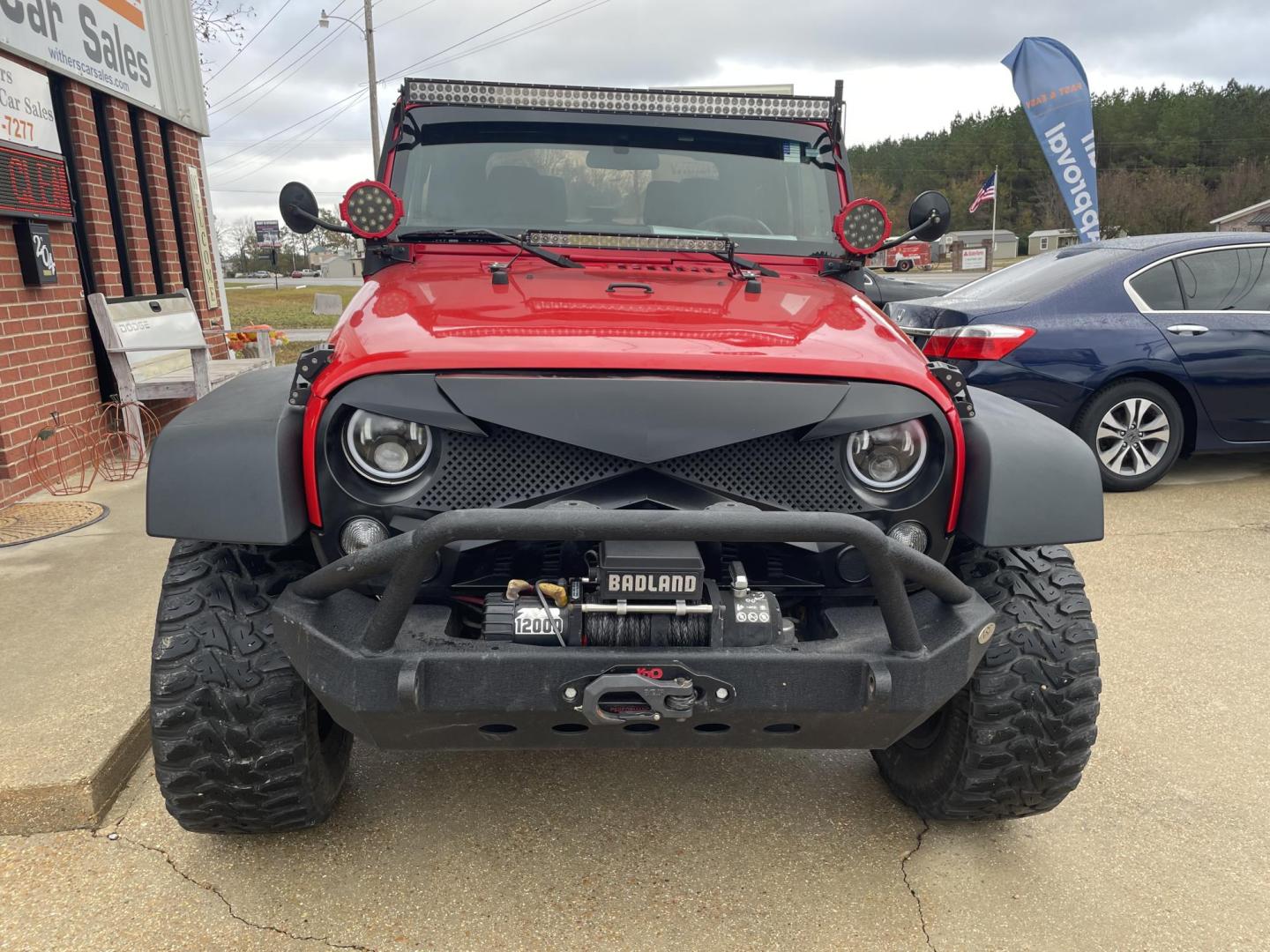 2015 Red /Black Jeep Wrangler Sport 4WD (1C4AJWAG8FL) with an 3.6L V6 DOHC 24V FFV engine, Auto transmission, located at 204 Hwy. 16 East, Carthage, MS, 39051, (601) 267-7277, 0.000000, 0.000000 - Photo#2