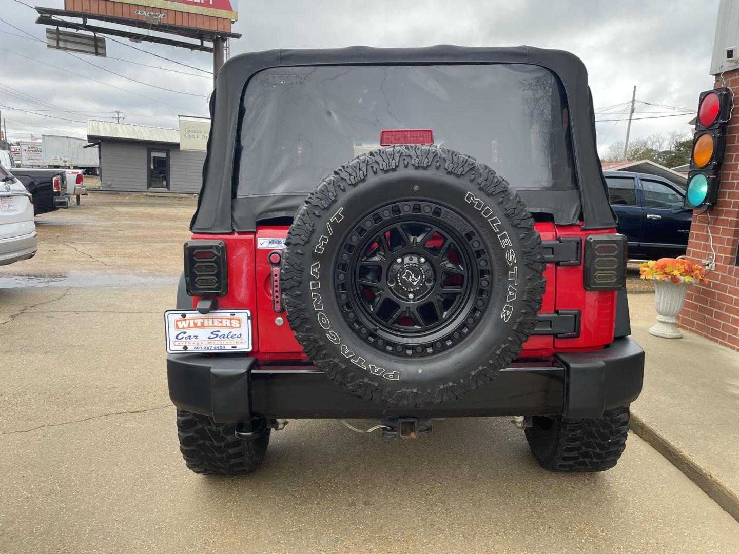 2015 Red /Black Jeep Wrangler Sport 4WD (1C4AJWAG8FL) with an 3.6L V6 DOHC 24V FFV engine, Auto transmission, located at 204 Hwy. 16 East, Carthage, MS, 39051, (601) 267-7277, 0.000000, 0.000000 - Photo#3