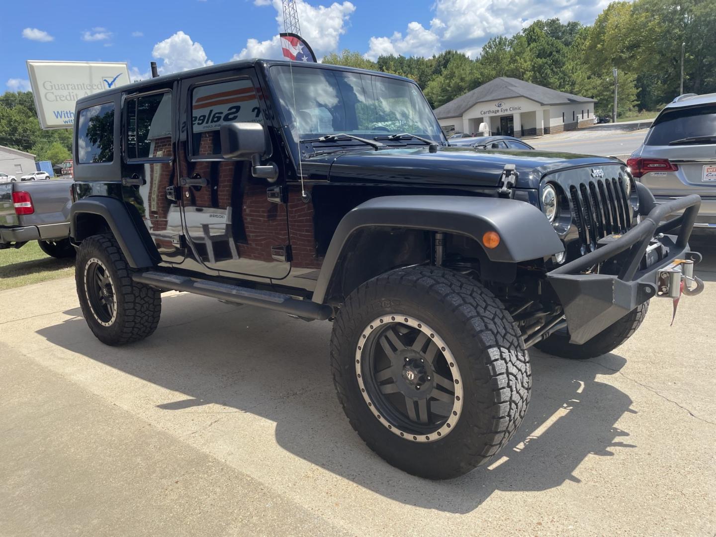 2014 Black /Black Jeep Wrangler Unlimited Sport 4WD (1C4BJWDGXEL) with an 3.6L V6 DOHC 24V FFV engine, A transmission, located at 204 Hwy. 16 East, Carthage, MS, 39051, (601) 267-7277, 0.000000, 0.000000- Photo#1