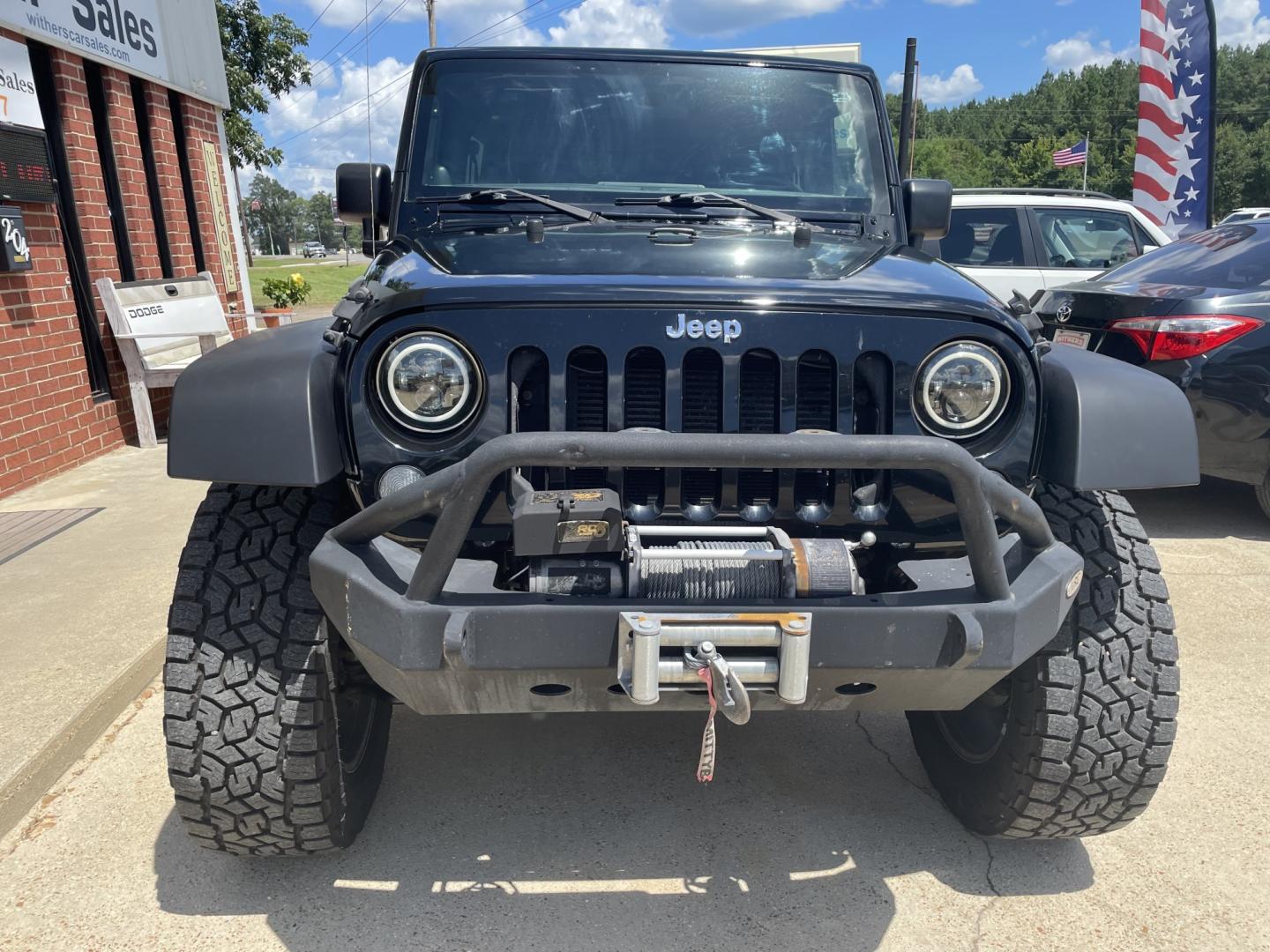 2014 Black /Black Jeep Wrangler Unlimited Sport 4WD (1C4BJWDGXEL) with an 3.6L V6 DOHC 24V FFV engine, A transmission, located at 204 Hwy. 16 East, Carthage, MS, 39051, (601) 267-7277, 0.000000, 0.000000- Photo#2
