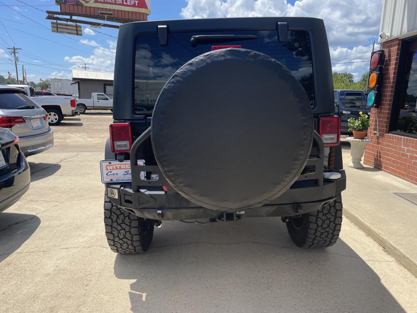 2014 Black /Black Jeep Wrangler Unlimited Sport 4WD (1C4BJWDGXEL) with an 3.6L V6 DOHC 24V FFV engine, A transmission, located at 204 Hwy. 16 East, Carthage, MS, 39051, (601) 267-7277, 0.000000, 0.000000- Photo#3